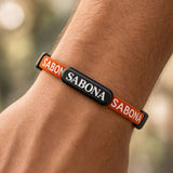 SABONA orange athletic magnetic bracelet worn on the wrist