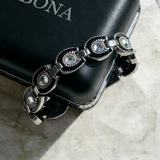 Close-up of SABONA Gem Black Horseshoe magnetic bracelet with cubic zirconia